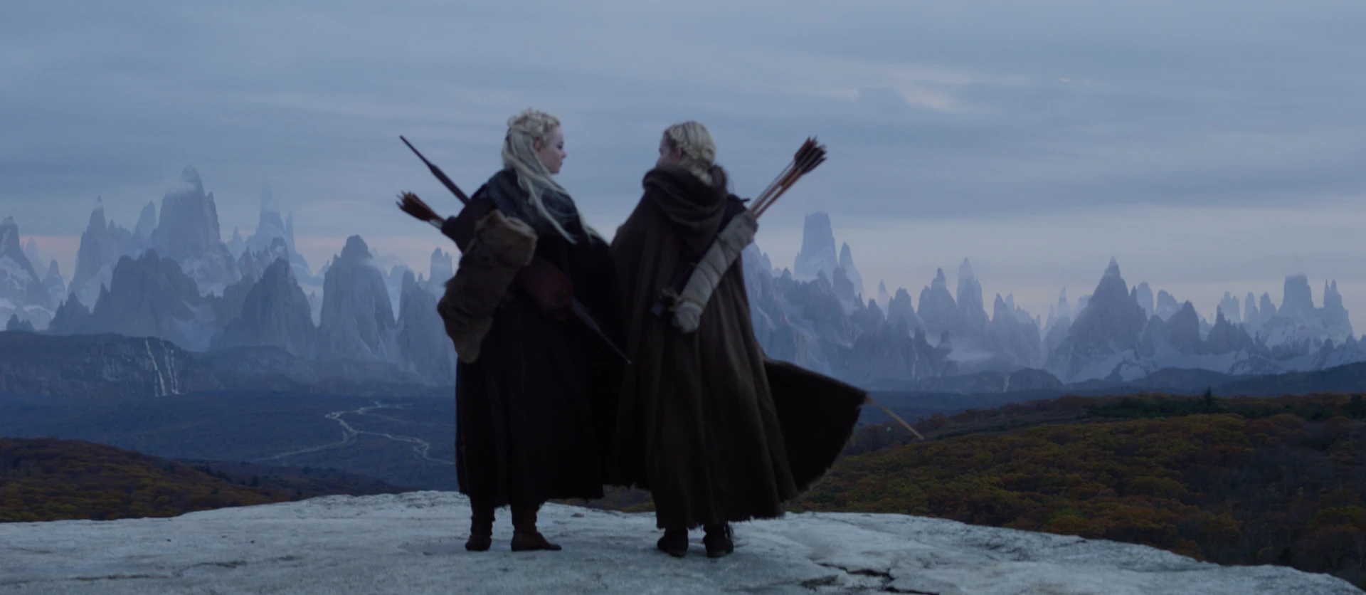 Maniac women with bows and mountains in the background Raynault vfx